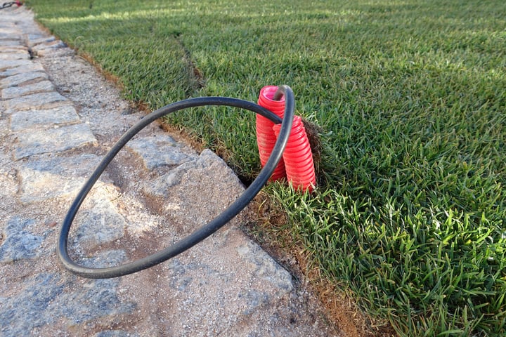 Pipes and wires ready for installation of garden lighting