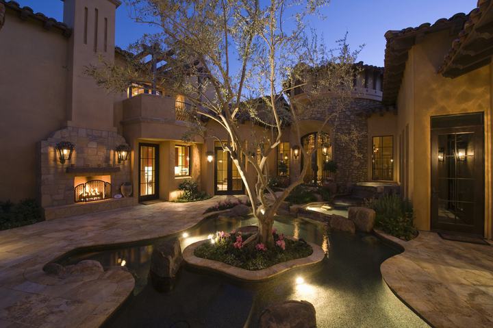 evening backyard with pool landscape lights