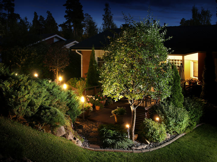 Evening rock garden with family house