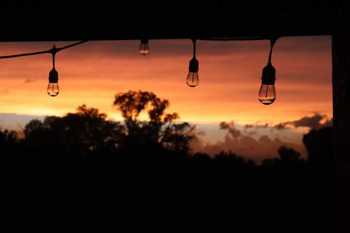 Patio lights during colourful sunset