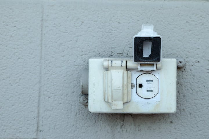 Old rustic North American electrical outlet