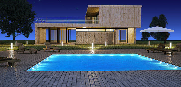 Modern house with swimming pool in night